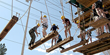 Group works their way across our high ropes course team building activity in Tuscon Arizona