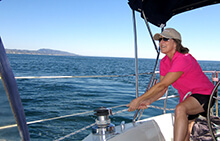 Team member securing a line during our sailing team building activity in Orange County California