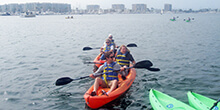 Teams enjoy a brief kayak exploration in Santa Monica California during our Get, Set, Go! team building activity