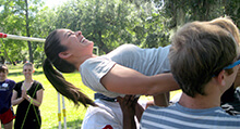 Participant being carried through the Web during our Pursuit team building activity in New Orleans Louisiana