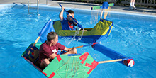 Captains racing their decorative boats during our Build a Boat team building activity in Massachusetts