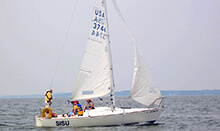 Group rotates roles during our sailing team building activity in Ohio