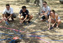 Group works in tandem to solve Precious Cargo team building activity in Austin Texas