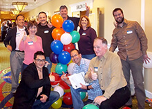 Group poses in front of their balloon tower as part of our Jumpstart team building activity in Virginia