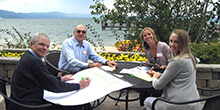 A group planning their presentation in the afternom sun during our corporate training workshop