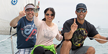 Colleagues practice teamwork during our sailing team building activity in California